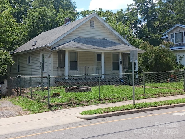 view of front of house with a front lawn and a porch