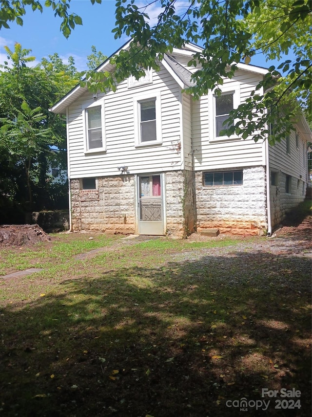 exterior space with a front lawn