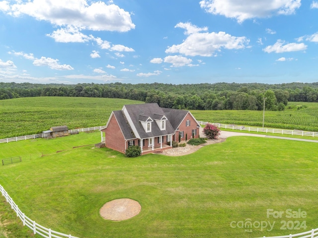 bird's eye view featuring a forest view and a rural view