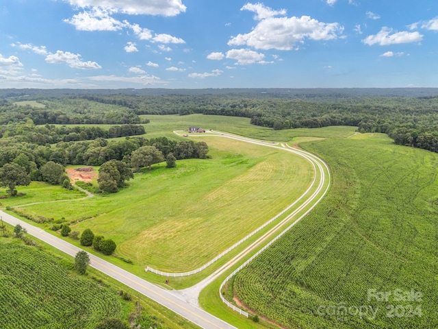 birds eye view of property with a rural view