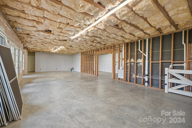 misc room with concrete flooring