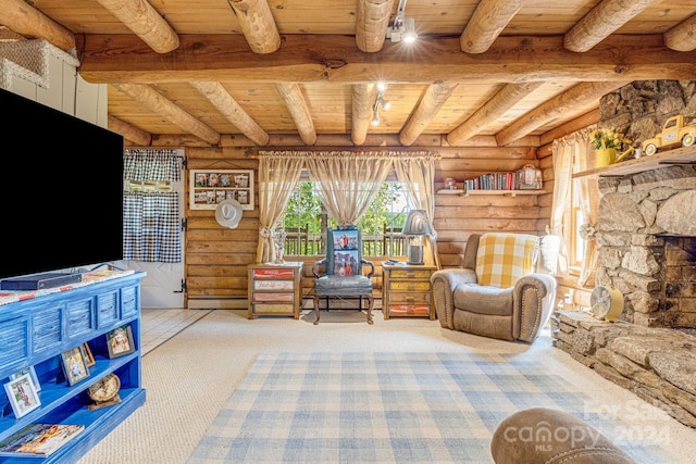 sitting room with a fireplace, log walls, wood ceiling, beamed ceiling, and carpet floors