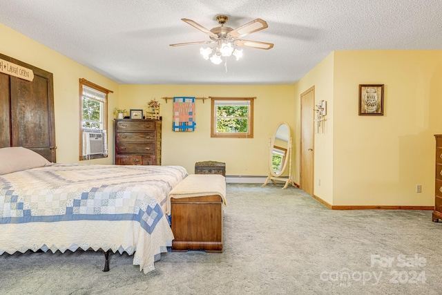 bedroom featuring ceiling fan, carpet floors, and multiple windows