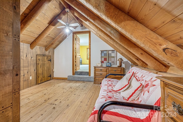 bedroom with light hardwood / wood-style flooring, ceiling fan, wooden ceiling, and lofted ceiling with beams