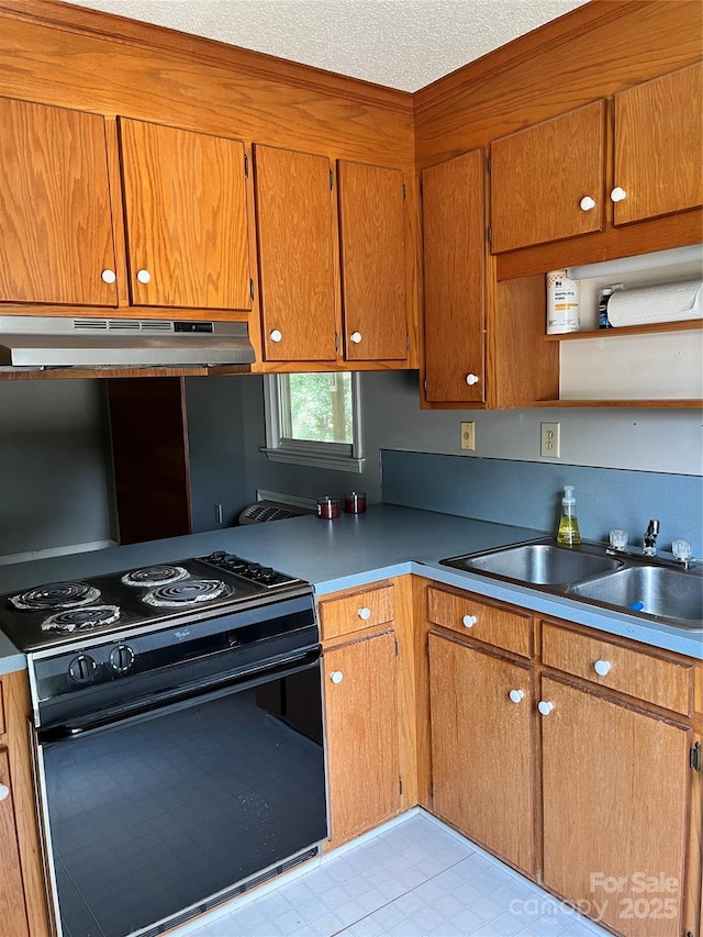 kitchen featuring brown cabinets, black electric range oven, light floors, under cabinet range hood, and a sink