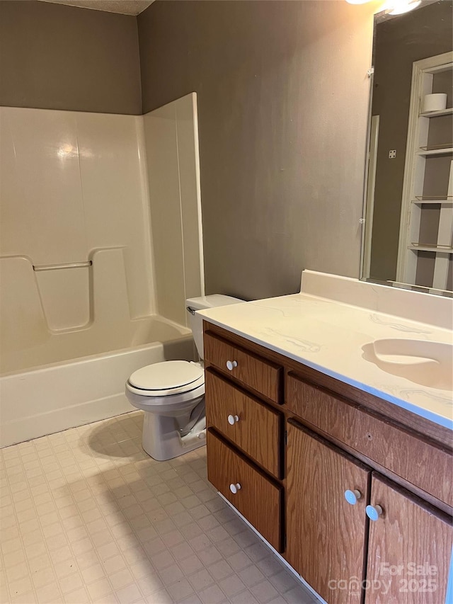 bathroom with shower / washtub combination, vanity, and toilet