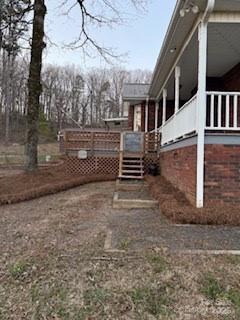 view of yard featuring a wooden deck