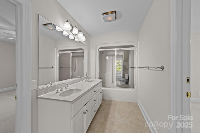 bathroom with tile patterned floors and vanity