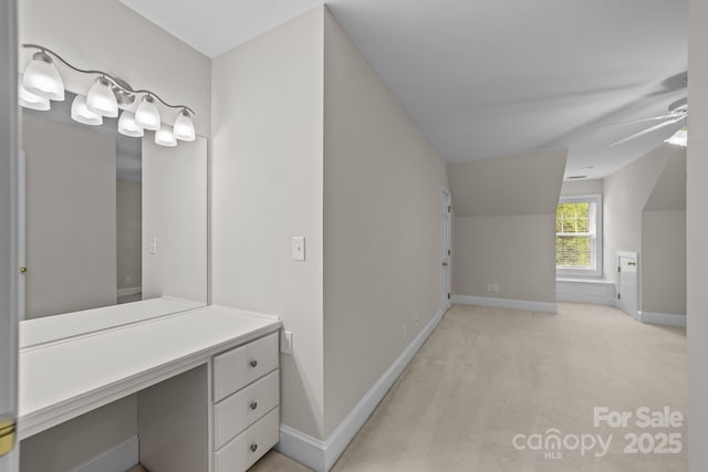 bathroom featuring lofted ceiling and ceiling fan