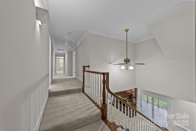 hallway featuring light carpet, baseboards, ornamental molding, and an upstairs landing