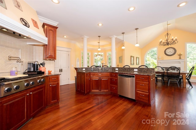 kitchen featuring pendant lighting, appliances with stainless steel finishes, dark hardwood / wood-style floors, custom exhaust hood, and dark stone counters