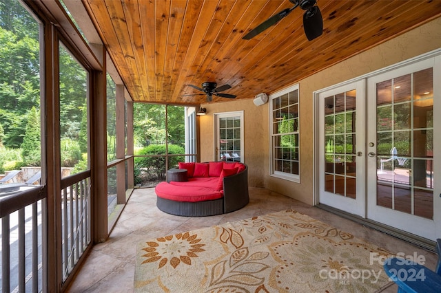 unfurnished sunroom with wood ceiling, ceiling fan, and french doors