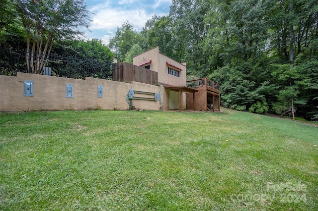 view of yard with a wooden deck