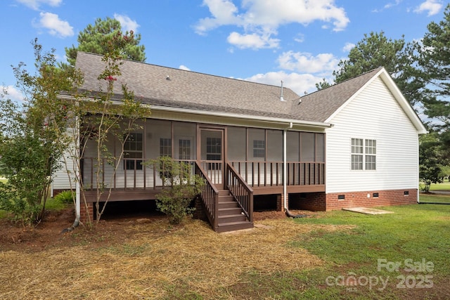 back of property with a lawn and a sunroom