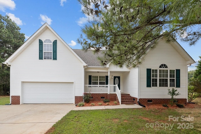 view of front of home featuring a porch, a garage, and a front lawn