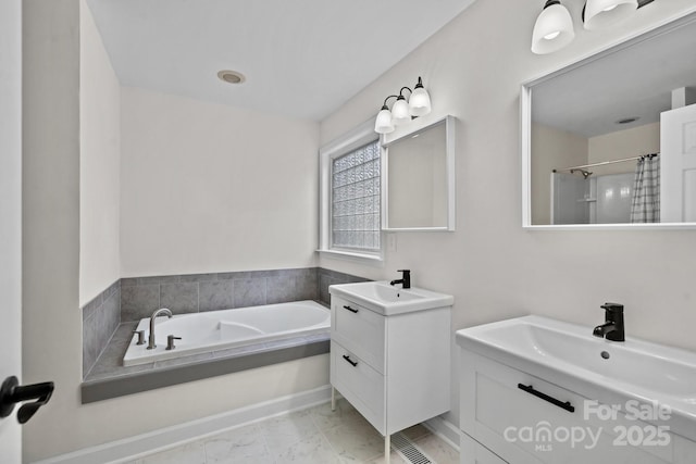 bathroom featuring vanity and separate shower and tub