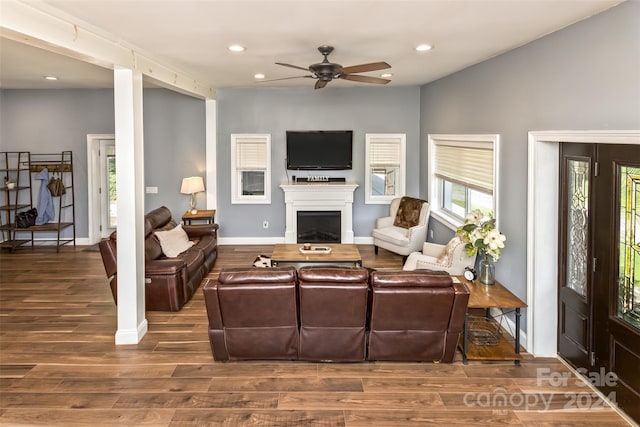 living room with hardwood / wood-style floors and ceiling fan