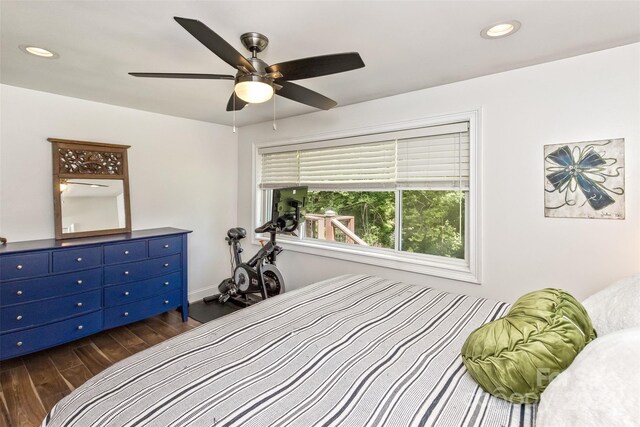 bedroom featuring ceiling fan and dark hardwood / wood-style flooring