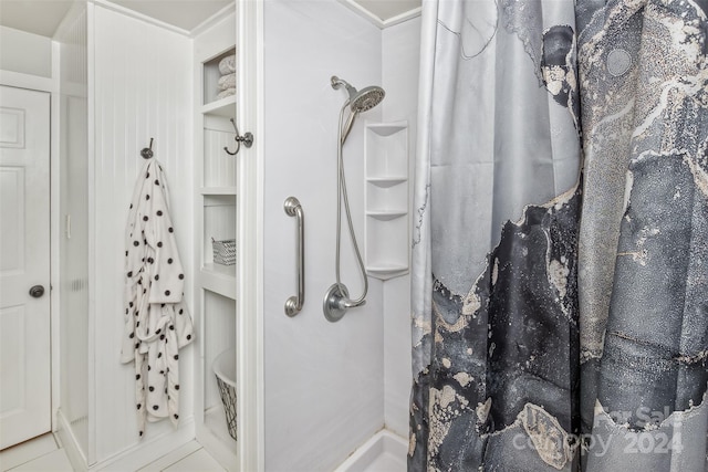 bathroom featuring tile patterned floors and a shower with shower curtain