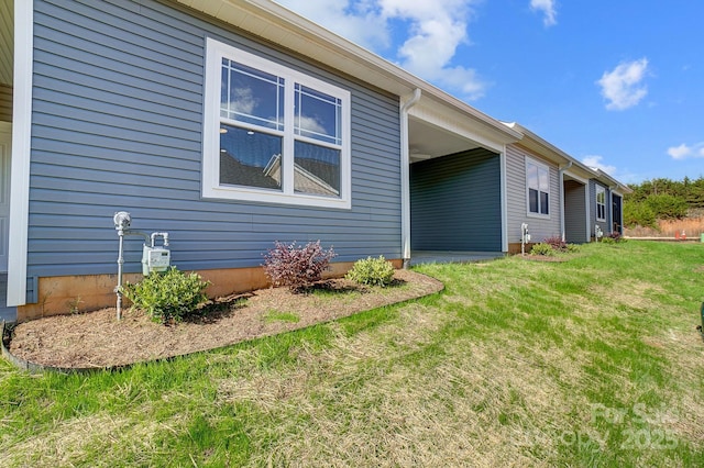 view of property exterior featuring a lawn