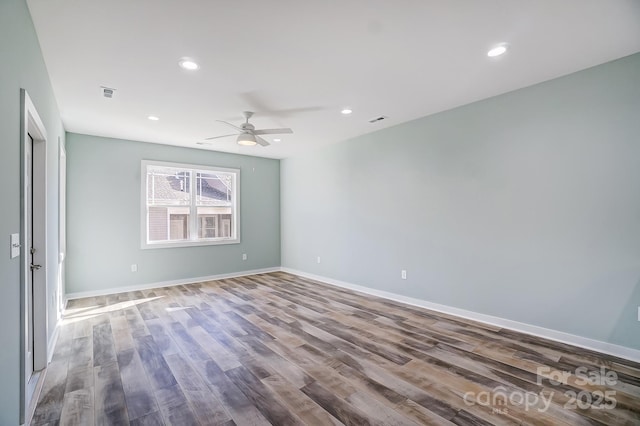 empty room featuring ceiling fan and wood-type flooring