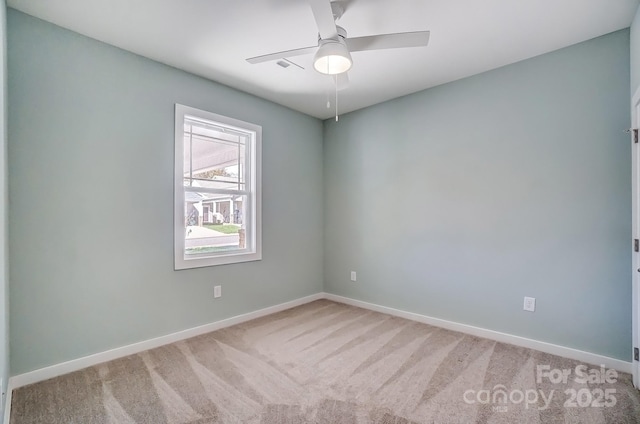 carpeted empty room with ceiling fan