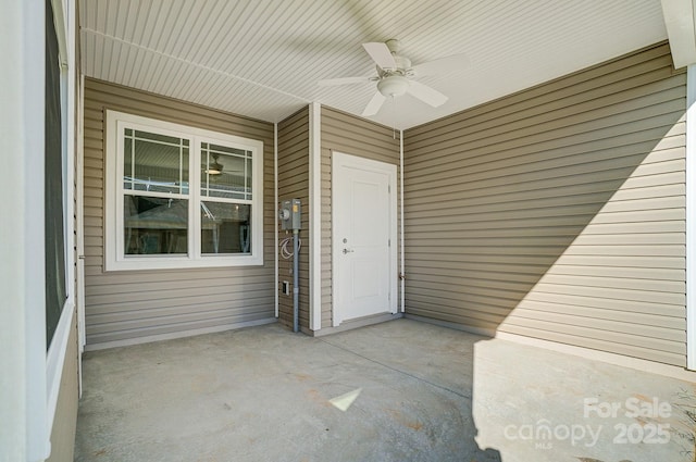 exterior space featuring ceiling fan