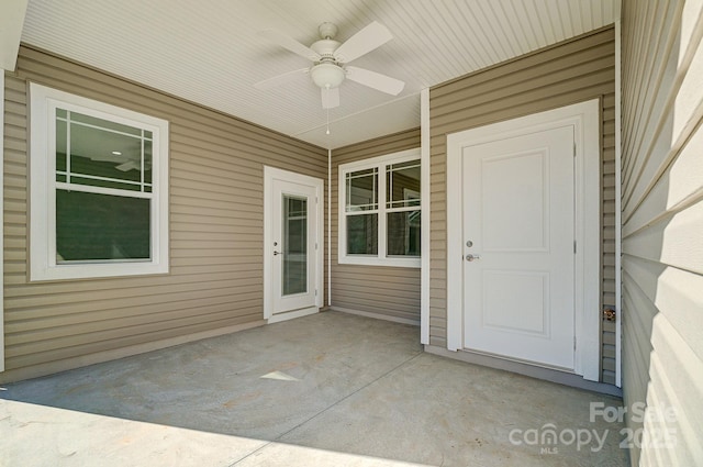 doorway to property featuring ceiling fan and a patio