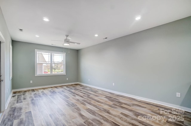 unfurnished room with light hardwood / wood-style flooring and ceiling fan