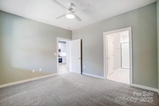 unfurnished bedroom with light colored carpet and ceiling fan