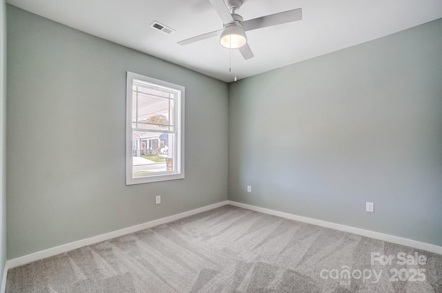 spare room with carpet floors and ceiling fan