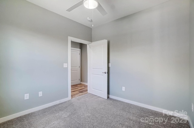 unfurnished bedroom featuring light colored carpet and ceiling fan