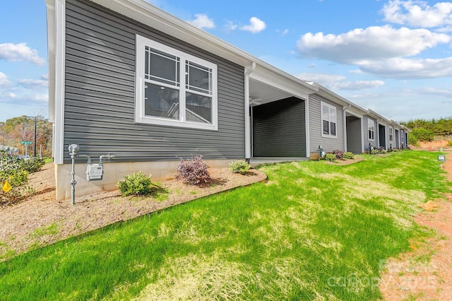 view of home's exterior featuring a yard