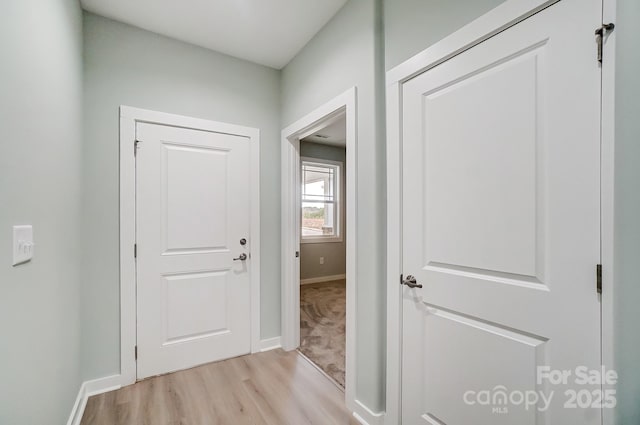 hallway featuring light hardwood / wood-style flooring