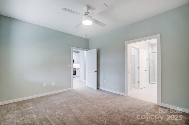 unfurnished bedroom with ceiling fan, connected bathroom, and light carpet