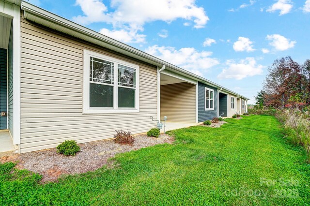 view of property exterior with a lawn