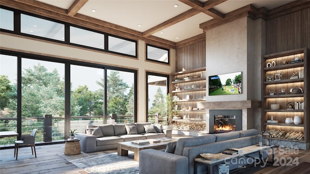 living room with hardwood / wood-style flooring, beamed ceiling, and a wealth of natural light