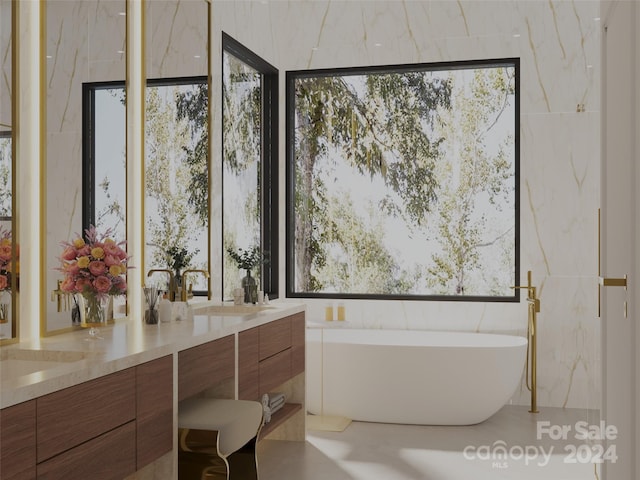 bathroom featuring vanity and tile walls