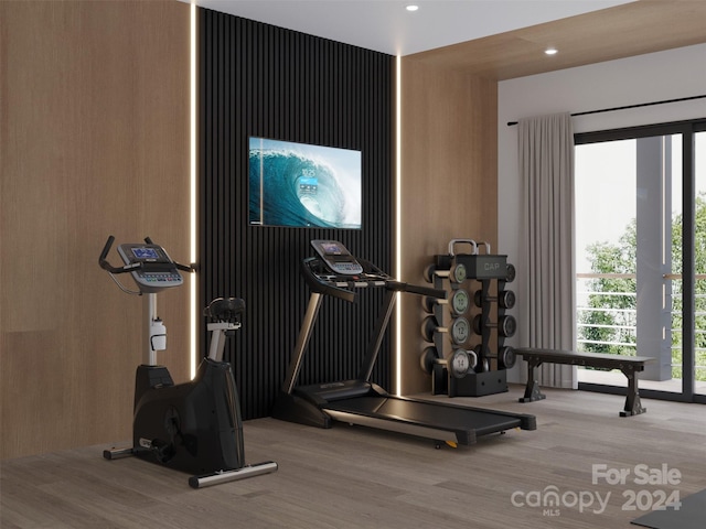 exercise area featuring hardwood / wood-style flooring