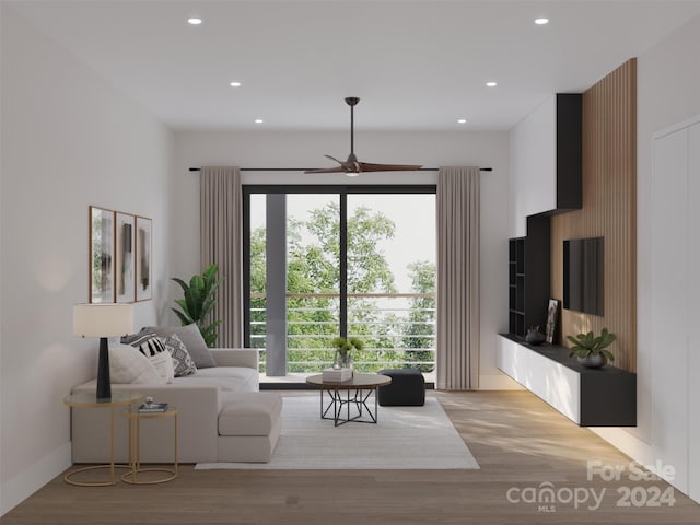 unfurnished living room with wood-type flooring and ceiling fan