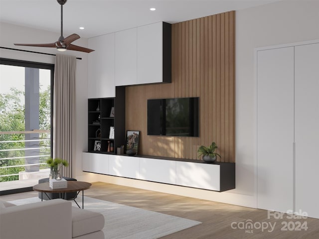 living room featuring ceiling fan and light wood-type flooring