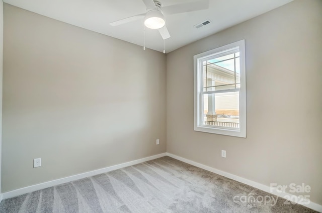 carpeted empty room with ceiling fan