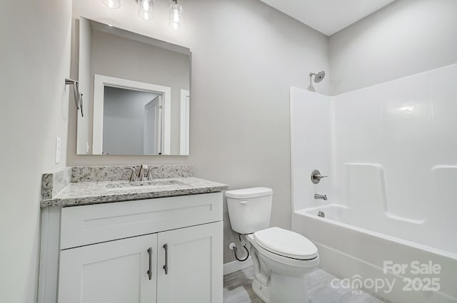 full bathroom featuring toilet, vanity, and shower / bathing tub combination