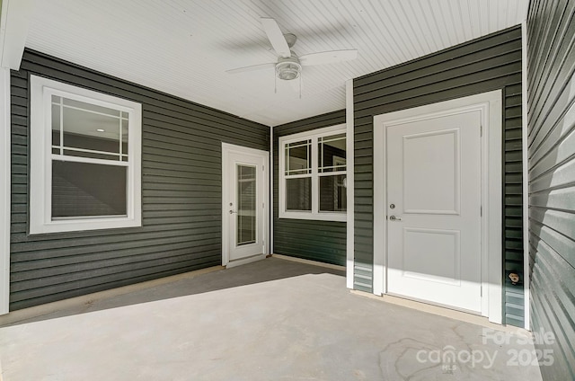 exterior space featuring ceiling fan