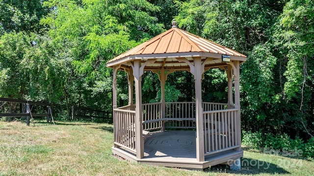 exterior space with a gazebo and a lawn