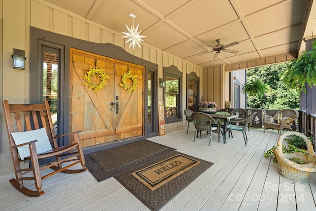 wooden deck featuring ceiling fan and covered porch