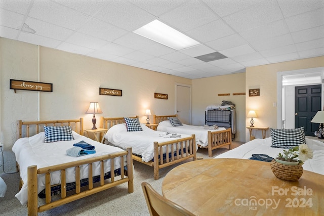 bedroom featuring a paneled ceiling