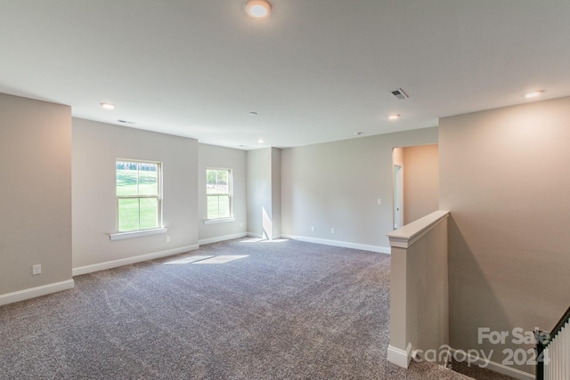 spare room featuring carpet floors