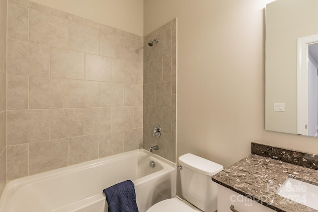 full bathroom featuring vanity, toilet, and tiled shower / bath