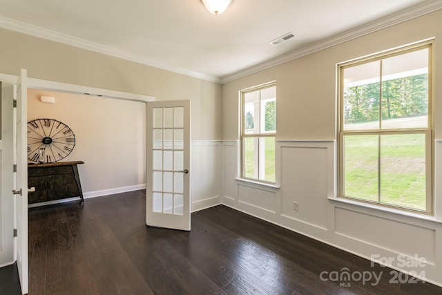 unfurnished room featuring dark wood-type flooring, crown molding, and french doors